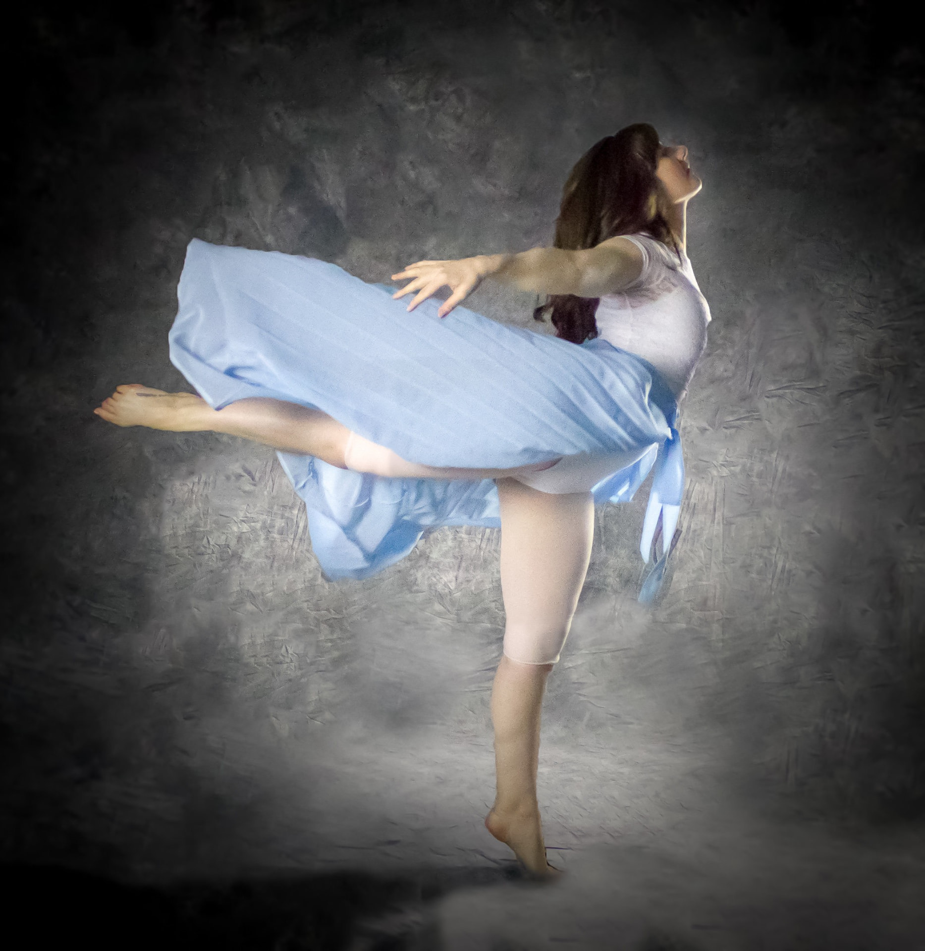 Oxbow Dance lyrical dancer in a blue skirt mid-pose
